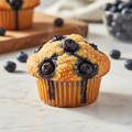 Freshly baked blueberry muffin on white marble