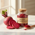 Glass jar of organic beetroot red food color with fresh beetroot